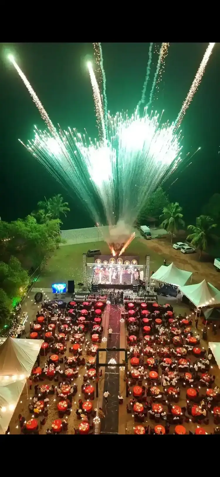 Large outdoor event with stage fireworks